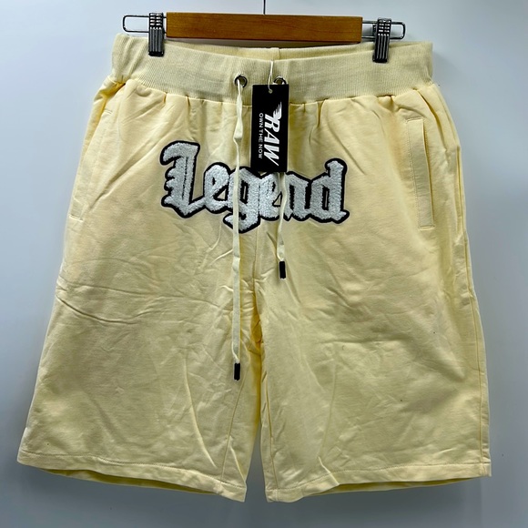 RAW OWN THE NOW MENS SIZE MEDIUM CREAM GRAPHIC PATCH LEGEND 2 POCKET SHORTS - Picture 1 of 9